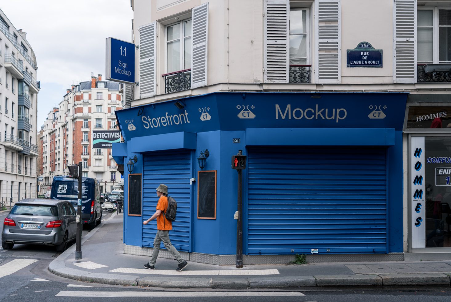 Blue storefront mockup with rolling shutters, signage, and pedestrian, ideal for presenting branding designs for designers.